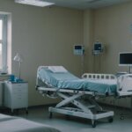 Modern hospital room with a hospital bed, side table, and medical equipment, highlighting comfort and care.